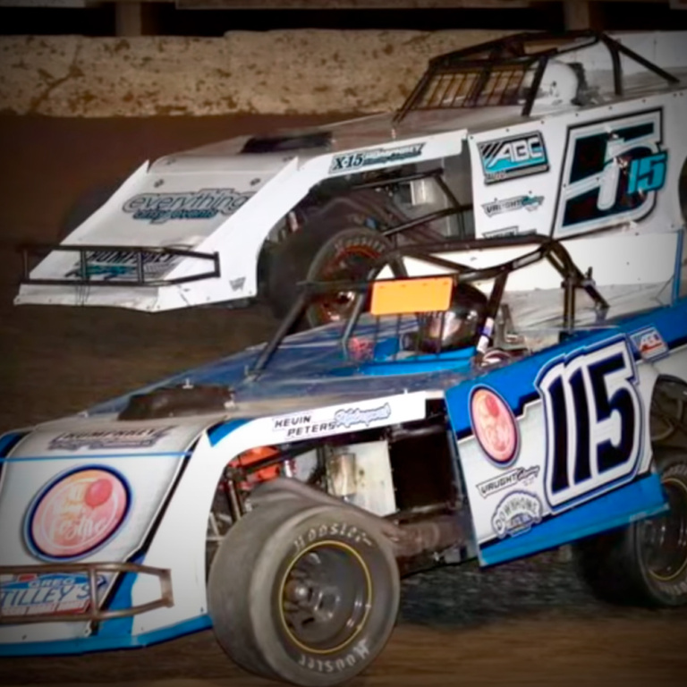 Race cars on dirt truck ready for a ProGlow car wash.