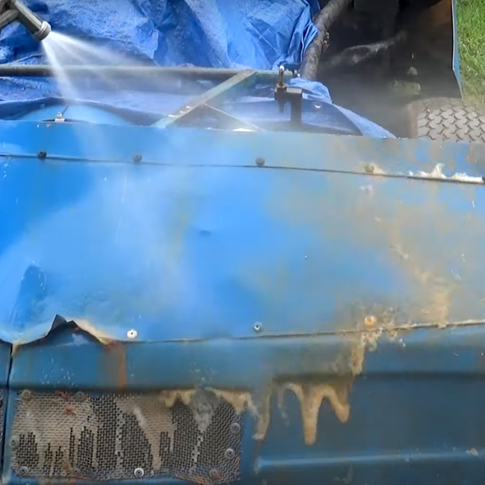 A race car comes clean after ProGlow Powersports wash is applied and rinsed off.